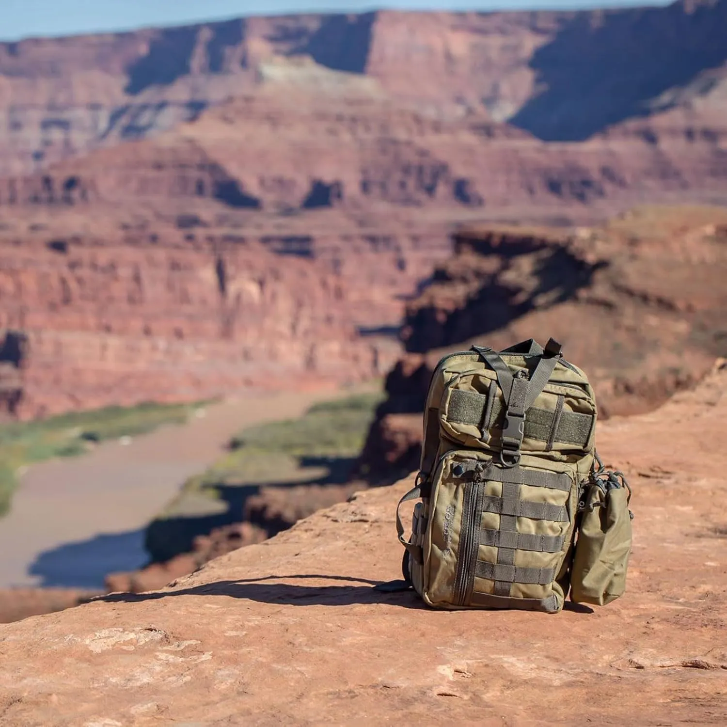 Yukon Outfitters Overwatch Sling Pack - EDC Hiking Outdoor Urban Ergonomic Spacious 20 Liter Tactical One-Shoulder Backpack | Bottle Cinch Pouch Included, Coyote/Foliage